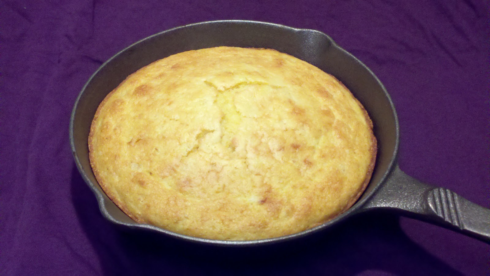 jiffy cornbread with creamed corn in cast iron skillet